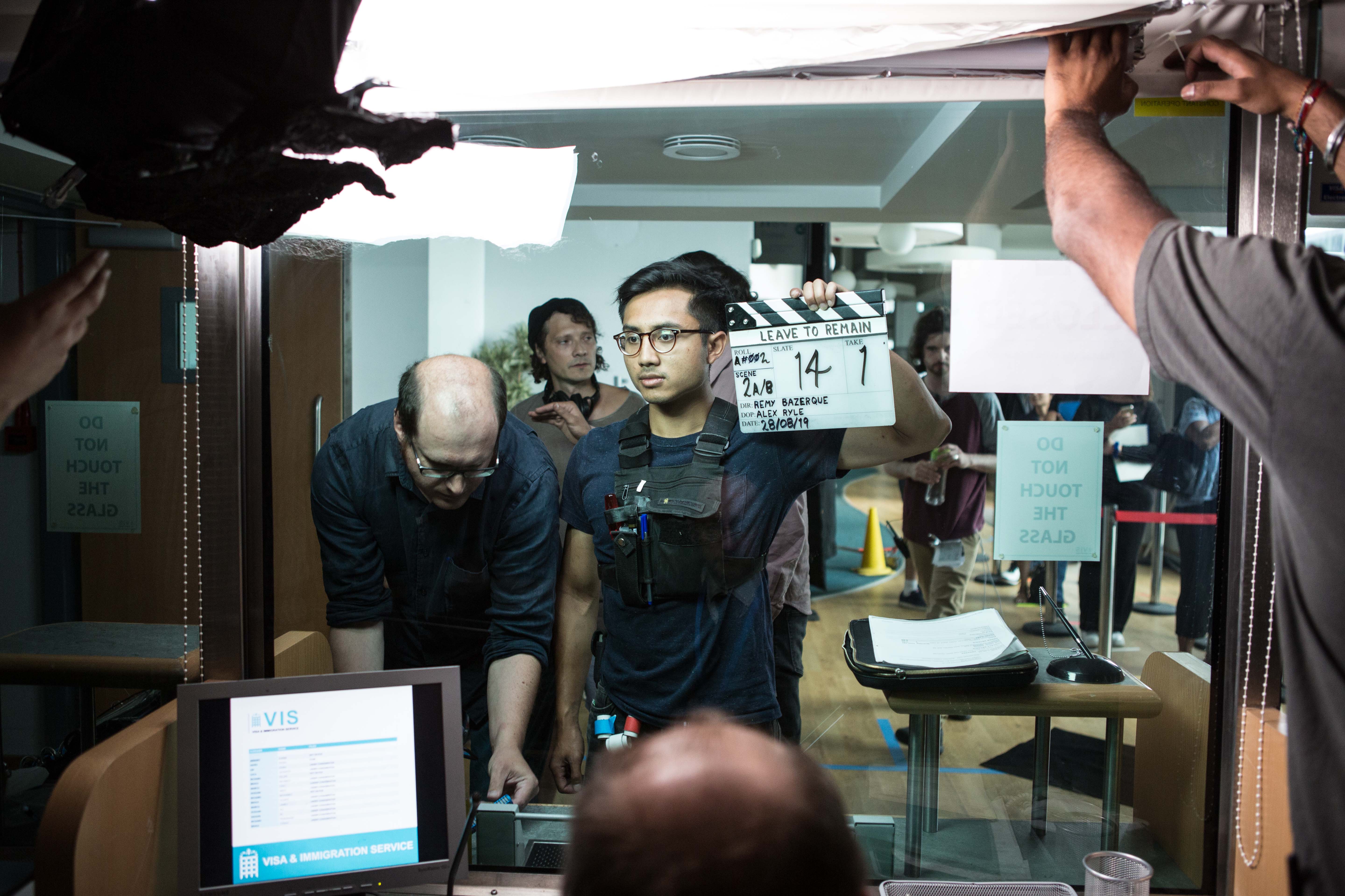 Behind the scenes on Leave to Remain, the clapperboard held in front of the camera on location